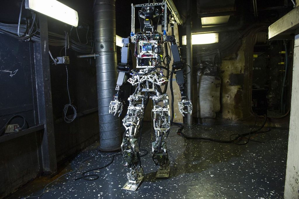 Humanoid Robots Are Learning to Recover, Not Just Walk A humanoid robot undergoing balance and movement testing inside a bright research laboratory.